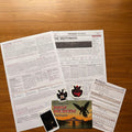Midnight Archive Mothman case file materials, flat lay