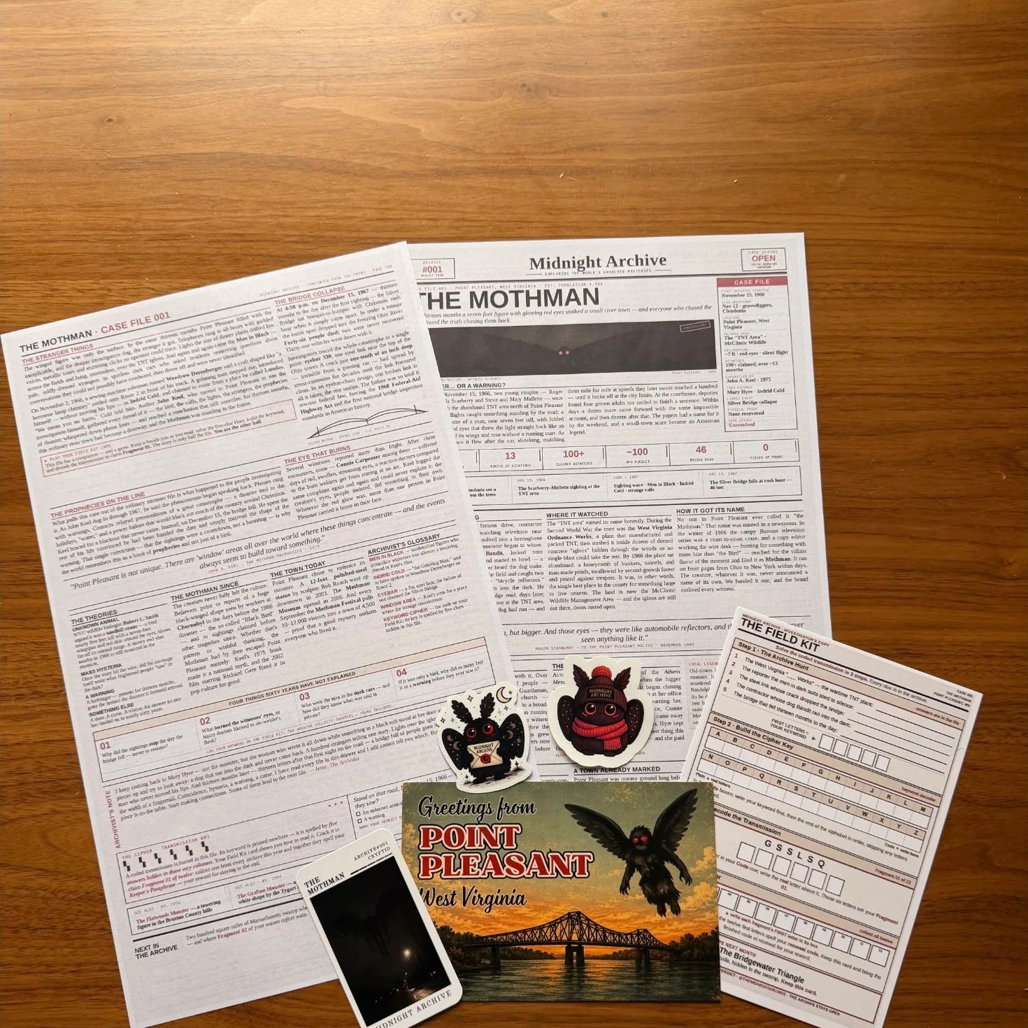Midnight Archive Mothman case file materials, flat lay